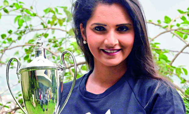Sania Mirza poses with the Wimbledon ladies doubles trophy at her home in Hyderabad on Tuesday (Photo: P. Surendra) Sania Mirza poses with the Wimbledon ladies doubles trophy at her home in Hyderabad on Tuesday (Photo: P. Surendra)